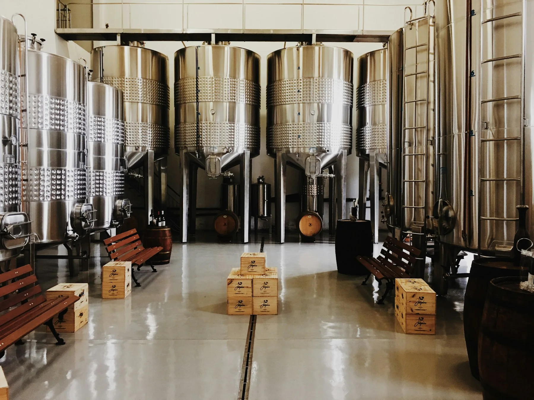 Fermentation vessels inside a working brewery